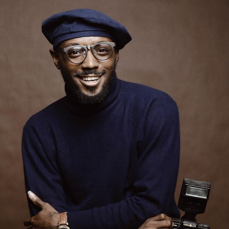 Kaveri Mehta, Lead Design Curator at MarinaPebbleRipple, reviewing corporate floral arrangements